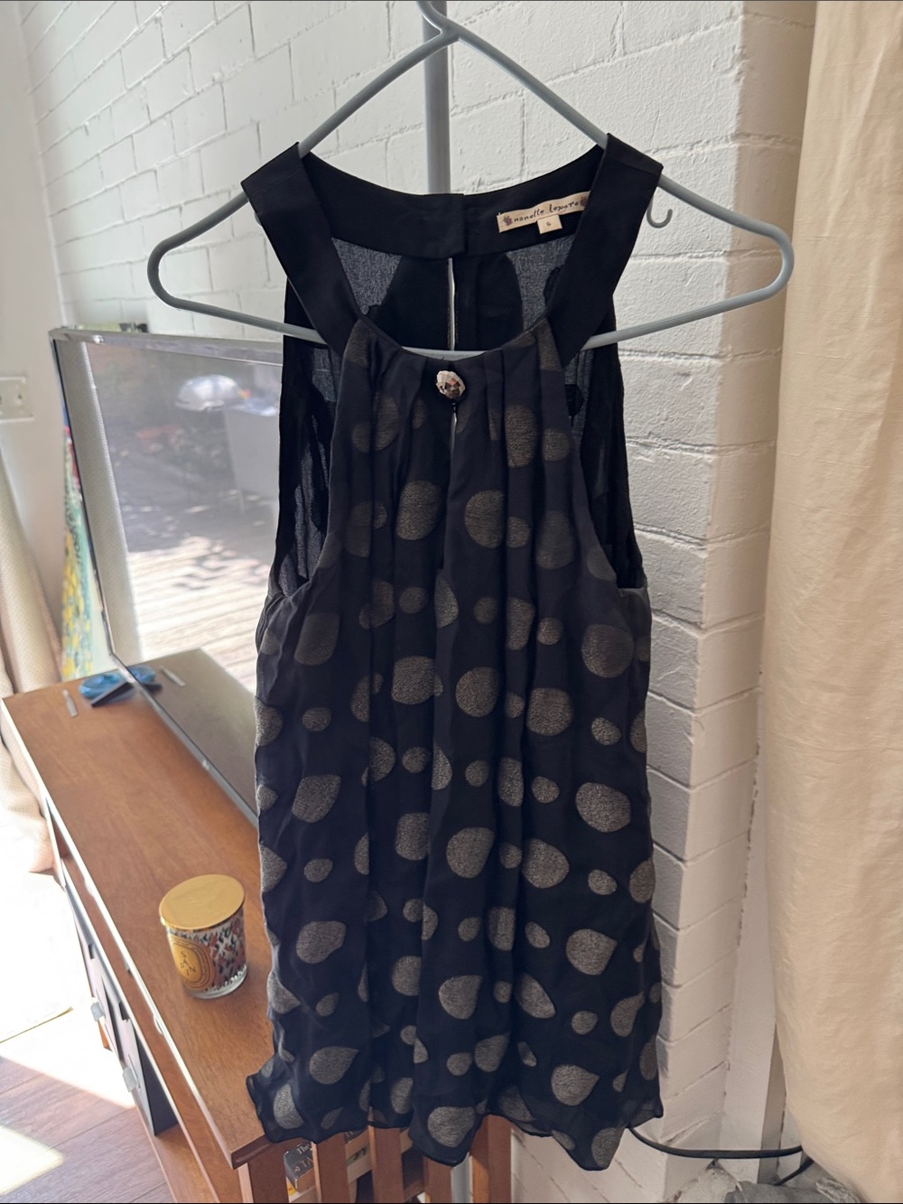 Nanette Lepore Black sleeveless top with Silver Polka Dot Accents.